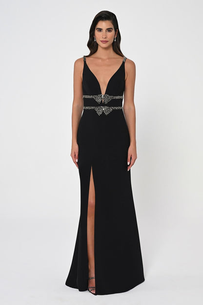 Indulge in sophistication with our Deep V Neck Waist Embroidered Long Dress. This dress is made of crepe material and features a flattering V-neckline, intricate rhinestones, and crystal embellishments for glamour. This dress is elegant and effortless with a closed back and invisible center-back zipper. Dry clean only.